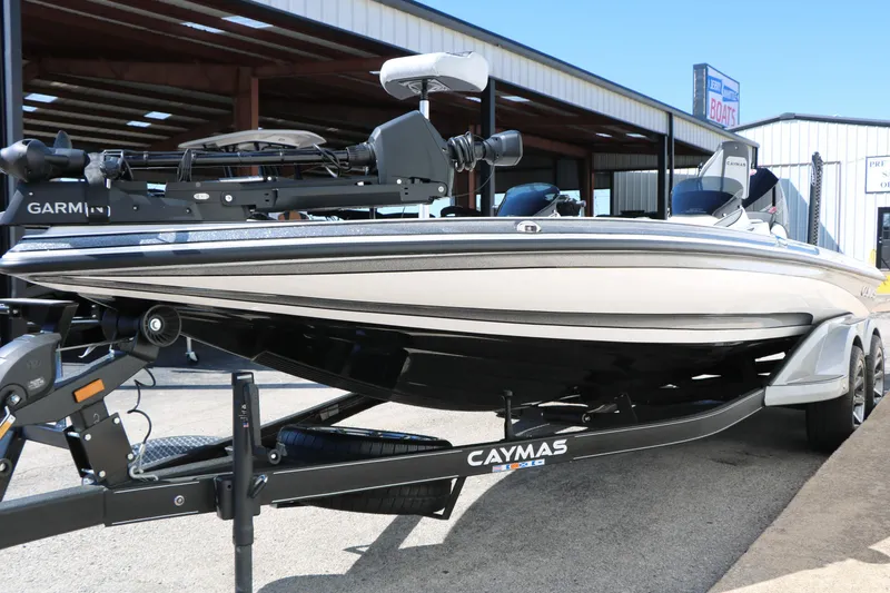 Slide: The Image of 2025 Caymas CX 21 PRO boat on trailer, featuring sleek design and advanced Garmin equipment. - 7