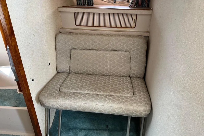 Slide: The Image of 1992 Regal Commodore 400 interior with cushioned seating and wooden accents. - 18