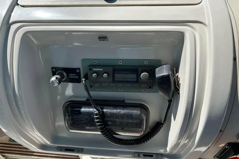 Slide: The Image of 1992 Regal Commodore 400 boat dashboard with radio and controls. - 22