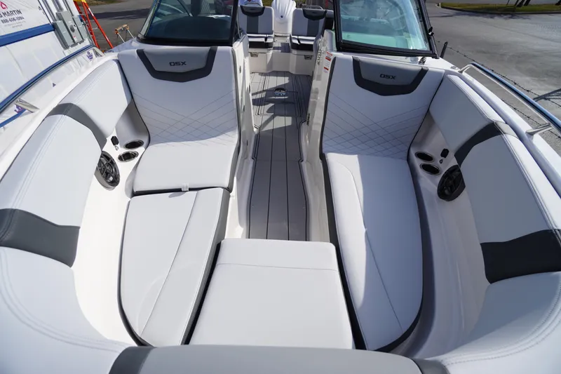 Slide: The Image of 2026 Chaparral 250 OSX boat interior with sleek white seating and modern design. - 9