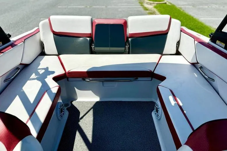 Slide: The Image of 2015 Scarab 215 HO Impulse boat interior with red and white seating. - 10