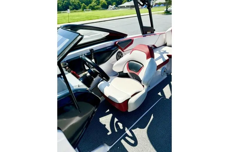 Slide: The Image of Interior of 2015 Scarab 215 HO Impulse boat with stylish seating and steering wheel. - 12