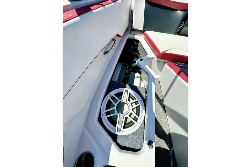 Slide: The Image of 2015 Scarab 215 HO Impulse boat interior with speaker and seating area. - 13