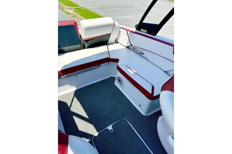 Slide: The Image of 2015 Scarab 215 HO Impulse boat interior with red and white seating. - 15