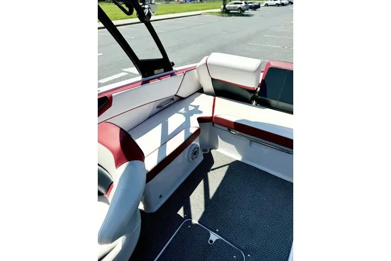 Slide: The Image of 2015 Scarab 215 HO Impulse boat interior with red and white seating. - 18