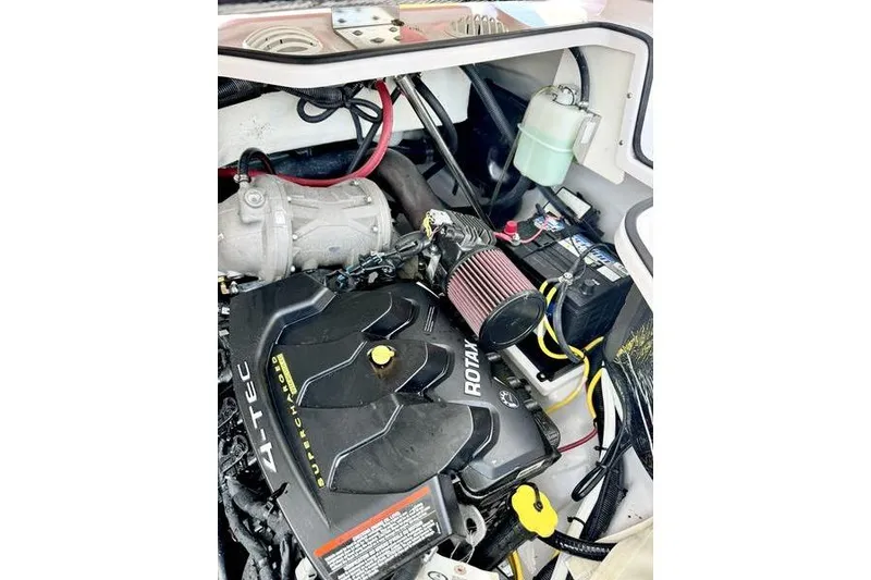 Slide: The Image of Engine compartment of a 2015 Scarab 215 HO Impulse boat, featuring a Rotax engine. - 20