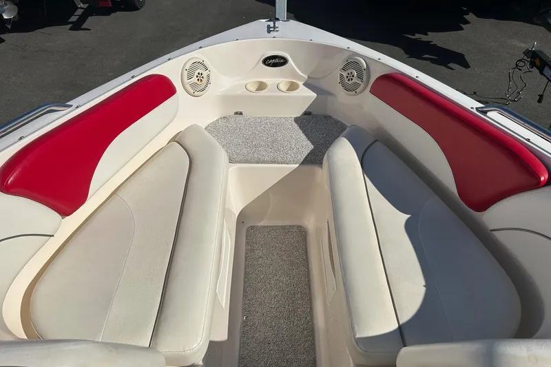 Slide: The Image of 2004 Rinker 212 Captiva Bowrider interior with red and white seating. - 6
