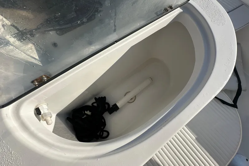 Slide: The Image of Open storage compartment on 2008 Sea Pro 186 Center Console boat, showing interior details. - 14