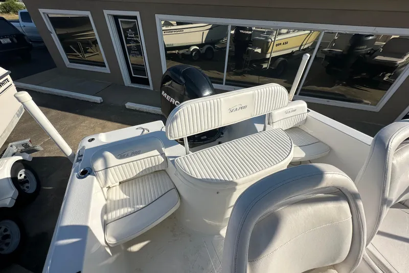 Slide: The Image of 2008 Sea Pro 186 Center Console boat with white seating and Mercury engine. - 16