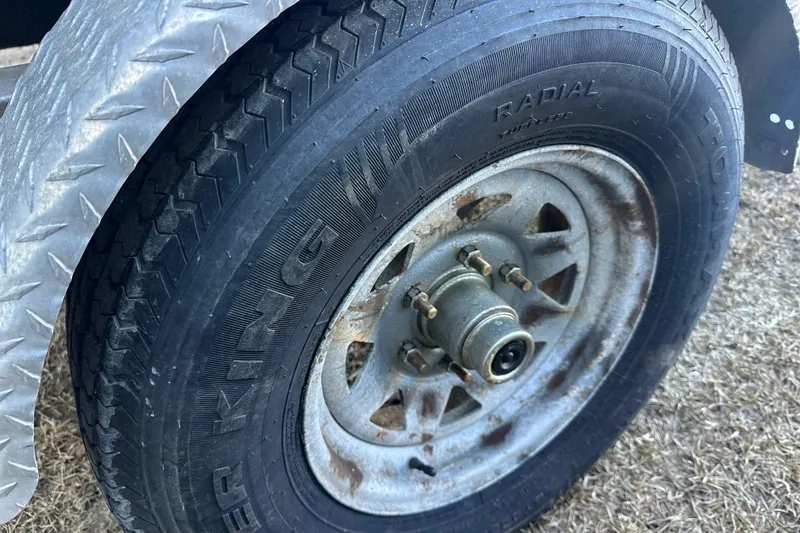 Slide: The Image of Close-up of a 2008 Sea Pro 186 Center Console trailer tire and wheel. - 21