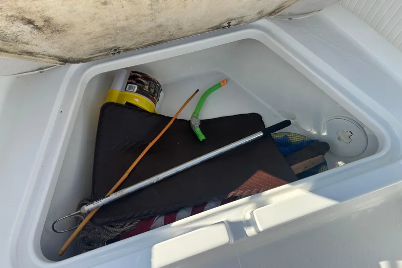 Slide: The Image of Storage compartment of 2008 Sea Pro 186 Center Console with various boating tools. - 5