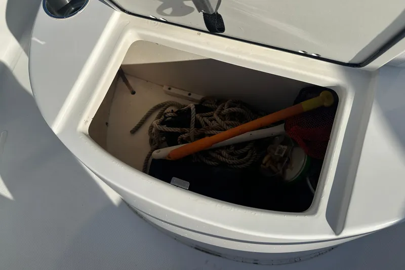 Slide: The Image of Storage compartment on 2008 Sea Pro 186 Center Console boat with ropes and equipment. - 7