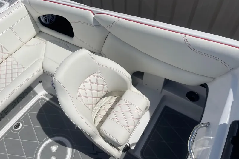 Slide: The Image of Luxurious white seating on 2026 Lightning Boat Works Strike 200, featuring elegant stitching and modern design. - 10