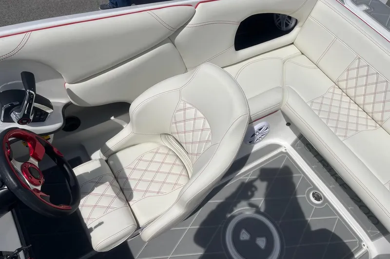 Slide: The Image of Luxurious interior of 2026 Lightning Boat Works Strike 200 with white leather seating. - 12