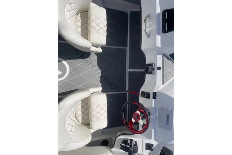 Slide: The Image of Interior of 2026 Lightning Boat Works Strike 200, featuring modern steering and seating. - 15