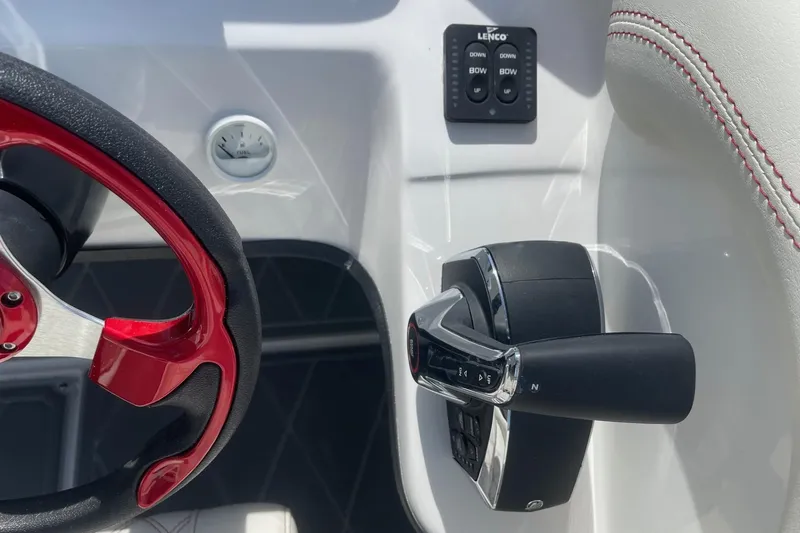 Slide: The Image of 2026 Lightning Boat Works Strike 200 steering wheel and throttle controls. - 16