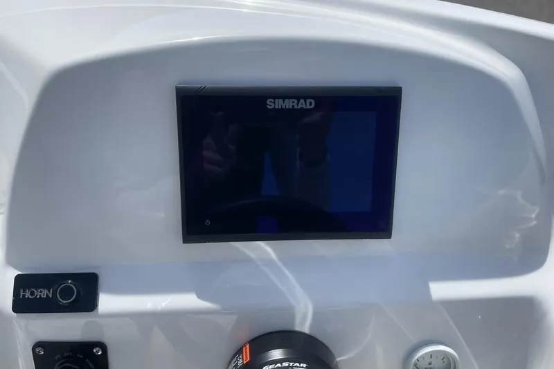 Slide: The Image of Control panel of 2026 Lightning Boat Works Strike 200 with Simrad display. - 19