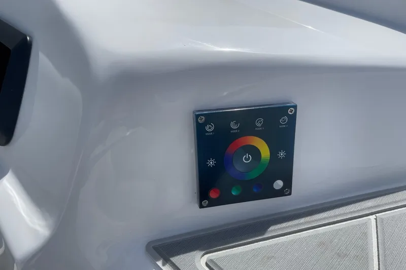 Slide: The Image of Control panel on 2026 Lightning Boat Works Strike 200, featuring colorful interface and mode options. - 20