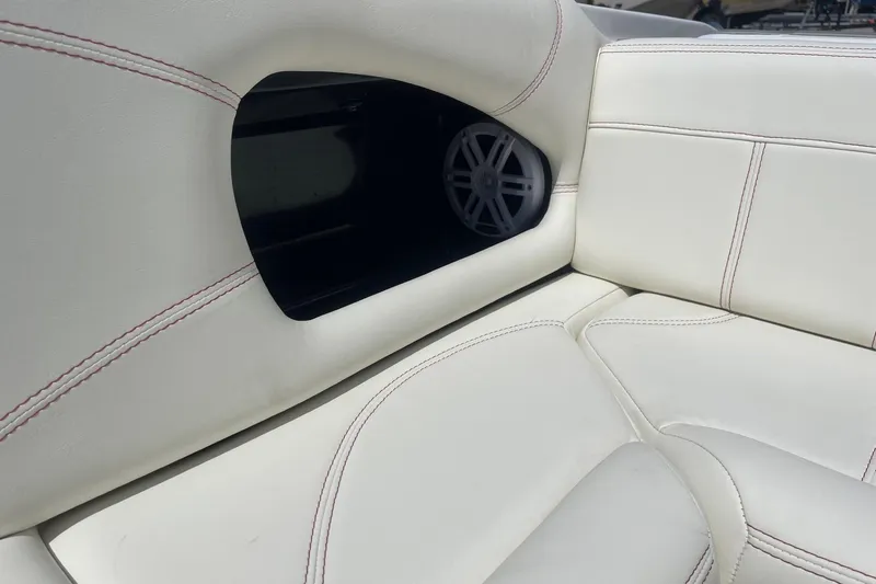 Slide: The Image of Luxurious white seating in 2026 Lightning Boat Works Strike 200 with speaker detail. - 24