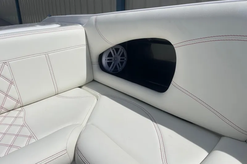 Slide: The Image of 2026 Lightning Boat Works Strike 200 interior with white leather seating and built-in speaker. - 26