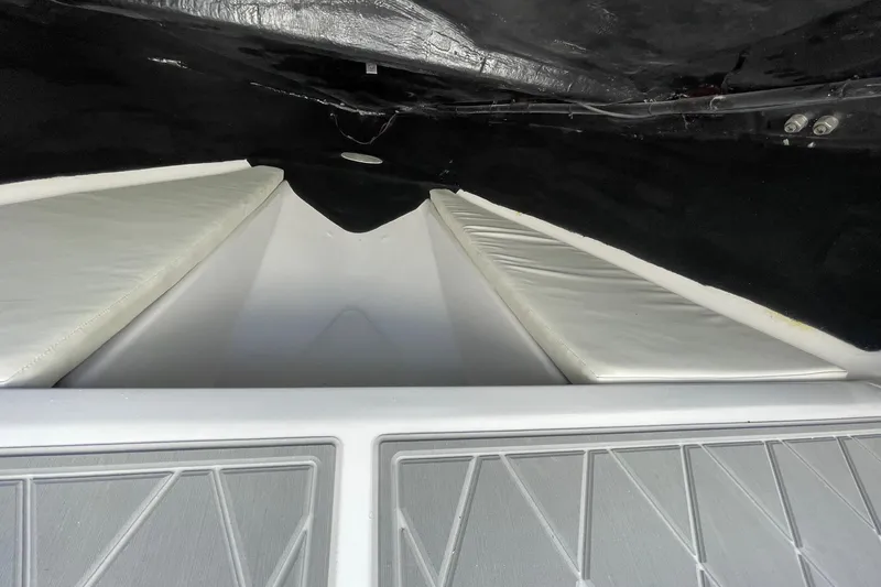 Slide: The Image of Interior view of 2026 Lightning Boat Works Strike 200, featuring sleek white seating. - 29