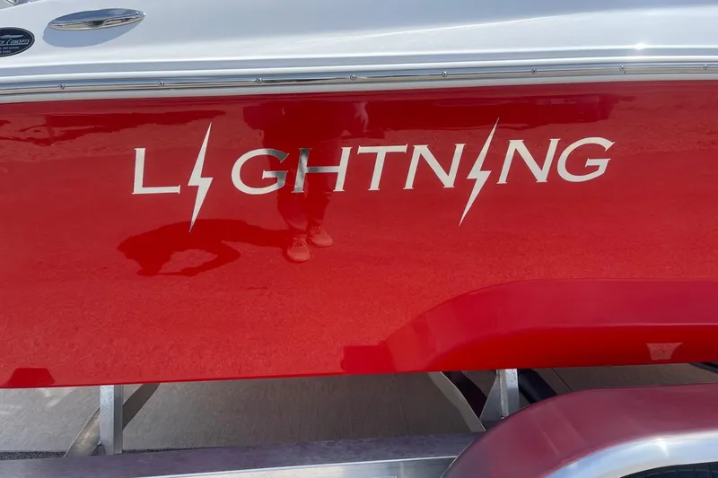 Slide: The Image of Red Lightning Boat Works Strike 200, 2026 model, with bold logo on the side. - 4