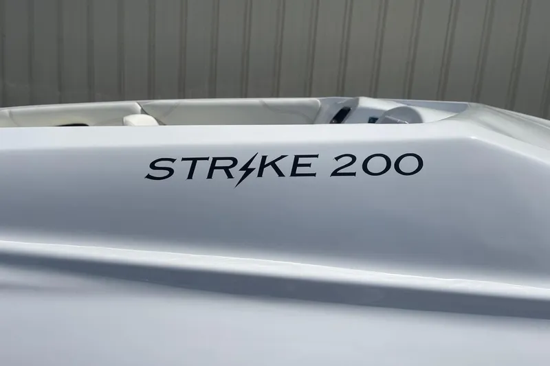 Slide: The Image of 2026 Lightning Boat Works Strike 200, sleek white design with bold lettering. - 5