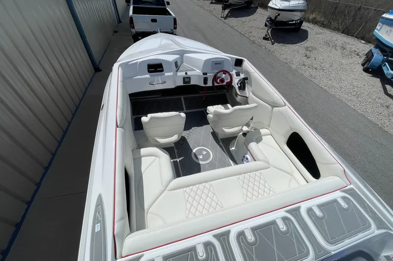 Slide: The Image of 2026 Lightning Boat Works Strike 200 interior with white seating and modern dashboard. - 6