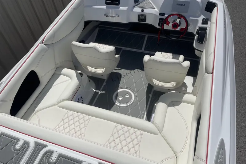 Slide: The Image of 2026 Lightning Boat Works Strike 200 interior with white leather seating and modern dashboard. - 7