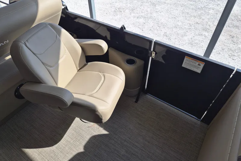Slide: The Image of 2026 Sylvan Mirage 820 CLZ DH interior with beige seating and cup holder. - 15