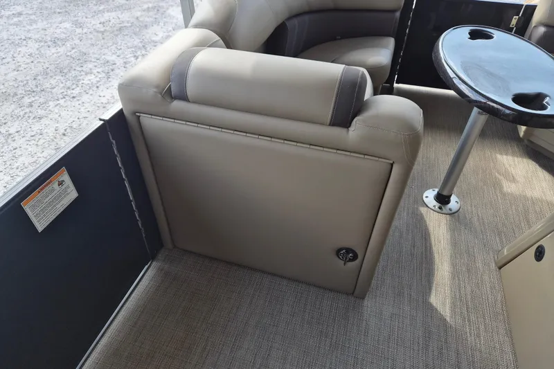 Slide: The Image of 2026 Sylvan Mirage 820 CLZ DH interior with beige seating and round table. - 7