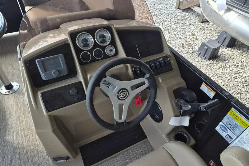 Slide: The Image of Steering console of 2026 Sylvan Mirage 820 CLZ DH pontoon boat, featuring gauges and controls. - 9