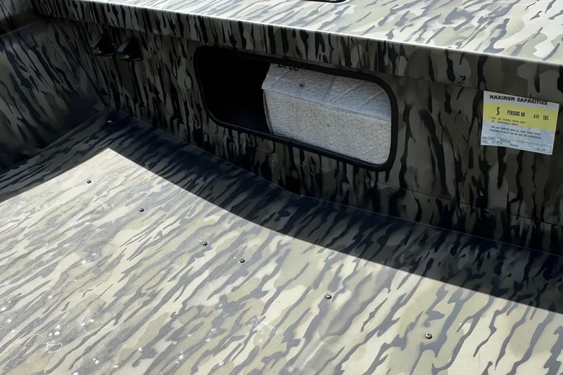 Slide: The Image of 2026 SeaArk 1652 Special boat interior with camouflage pattern and capacity label. - 6