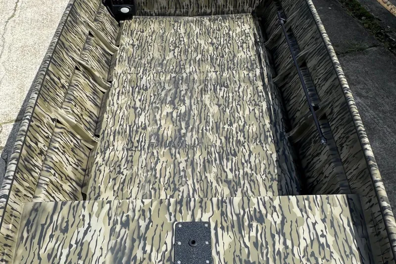 Slide: The Image of 2026 SeaArk 1652 Special boat interior with camouflage pattern design. - 8