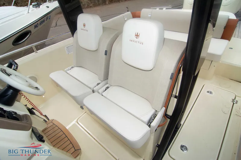 Slide: The Image of 2024 Invictus TT280S boat interior with dual seats and steering wheel. - 36
