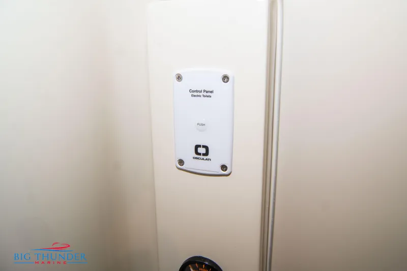 Slide: The Image of Control panel for electric toilets on 2024 Invictus TT280S boat. - 44