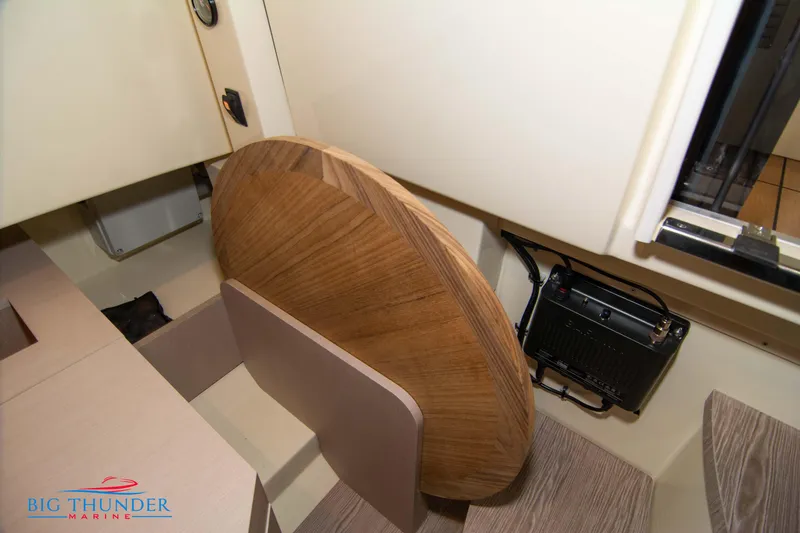 Slide: The Image of 2024 Invictus TT280S interior with wooden table and marine equipment. - 45
