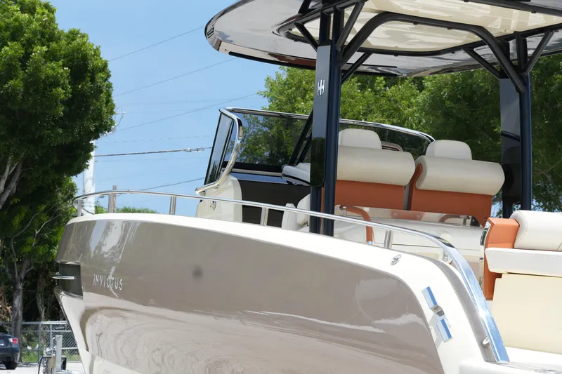 Slide: The Image of 2024 Invictus TT280S luxury boat with sleek design and comfortable seating. - 8
