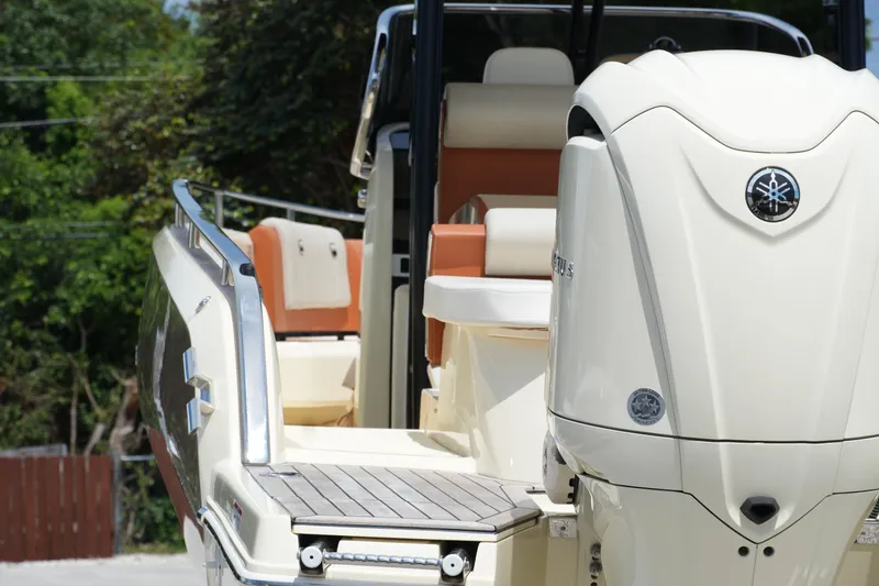 Slide: The Image of 2024 Invictus TT280S boat with Yamaha engine, featuring sleek design and luxurious seating. - 9