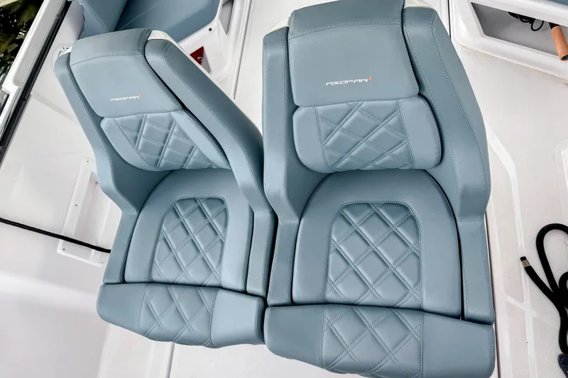 Slide: The Image of 2024 Axopar 25 Cross Top boat seats with elegant diamond stitching. - 6