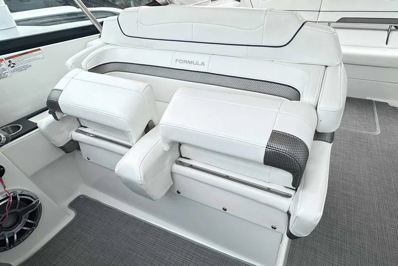 Slide: The Image of 2022 Formula 350 Crossover Bowrider I/O interior seating with white upholstery and modern design. - 13