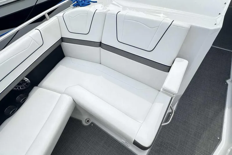 Slide: The Image of 2022 Formula 350 Crossover Bowrider I/O interior seating with white upholstery and cup holders. - 22