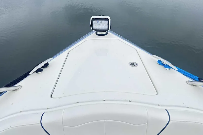 Slide: The Image of 2022 Formula 350 Crossover Bowrider I/O bow view with spotlight and blue rope. - 25