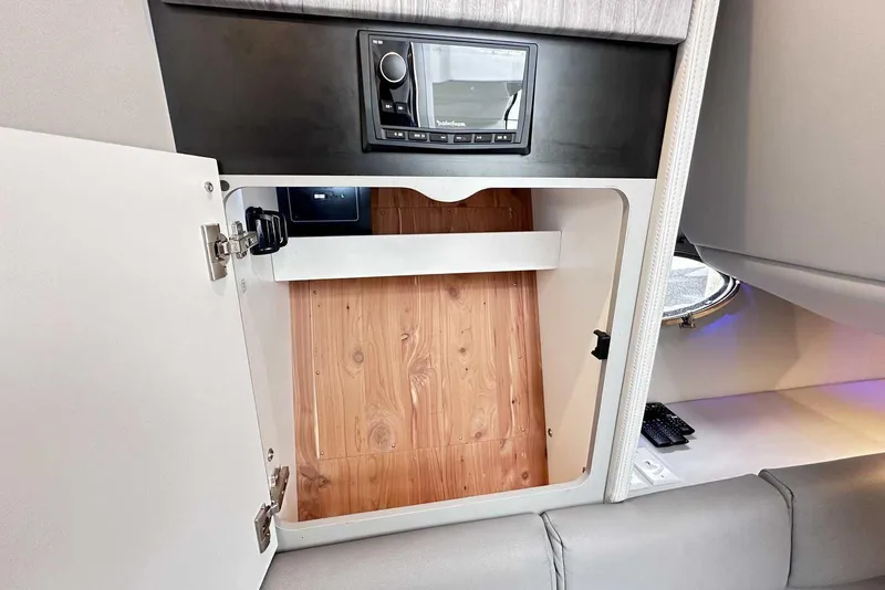 Slide: The Image of 2022 Formula 350 Crossover Bowrider I/O interior cabinet with stereo system. - 28