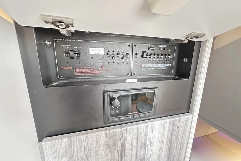 Slide: The Image of 2022 Formula 350 Crossover Bowrider I/O control panel with switches and display. - 29