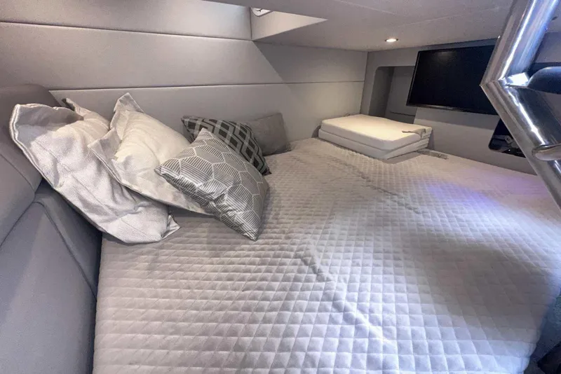 Slide: The Image of Luxurious cabin interior of 2022 Formula 350 Crossover Bowrider I/O with plush bedding. - 32
