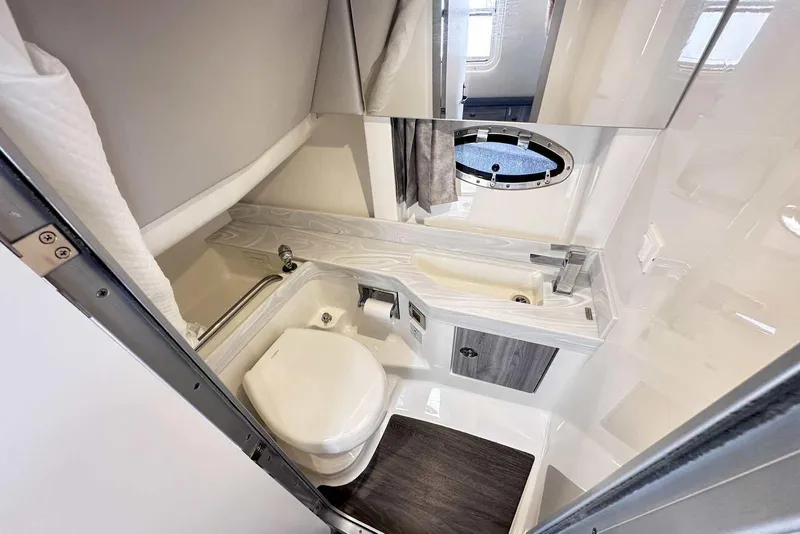 Slide: The Image of 2022 Formula 350 Crossover Bowrider I/O bathroom with modern fixtures and compact design. - 34