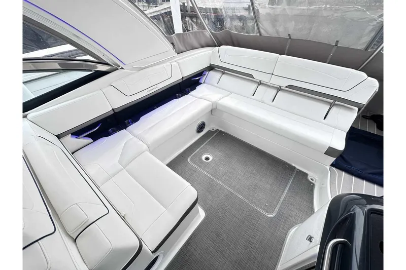 Slide: The Image of 2022 Formula 350 Crossover Bowrider I/O interior with white seating and modern design. - 5