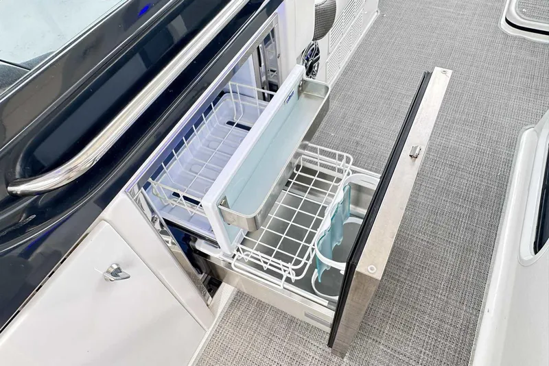 Slide: The Image of 2022 Formula 350 Crossover Bowrider I/O with open drawer refrigerator, showcasing interior storage. - 8