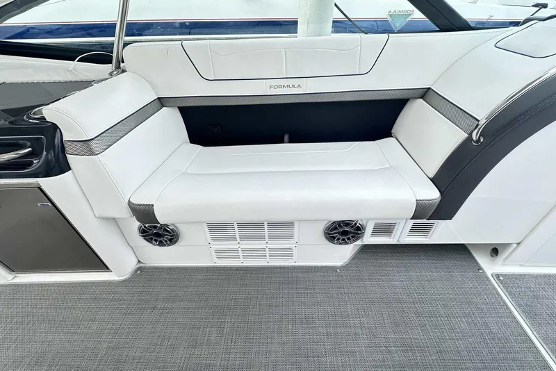 Slide: The Image of 2022 Formula 350 Crossover Bowrider I/O interior with white seating and modern design. - 9